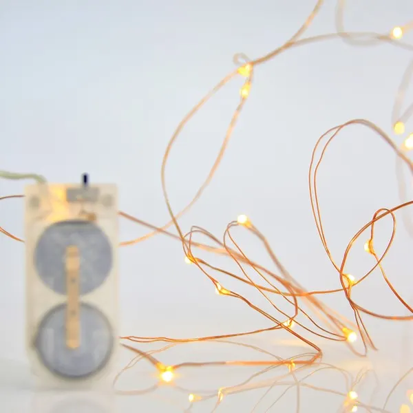 XMAS ΛΑΜΠΑΚΙ ΣΕΙΡΑ 12 MINI LED ΜΠΑΤΑΡΙΑΣ 2xCR2032 ΜΠΡΟΝΖΕ ΧΑΛΚΙΝΟ ΚΑΛΩΔΙΟ ΘΕΡΜΟ ΛΕΥΚΟ LED ANA 10cm IP20